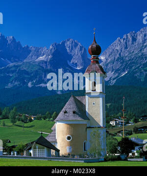 Going church and village and the Kaiser Wilhelm mountain range, Tirol, Austria Stock Photo
