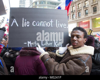 Rally Against Racism: Stand Up for Haiti and Africa in Times Square in NYC on Jan.15, 2018, Martin Luther King Day. Stock Photo