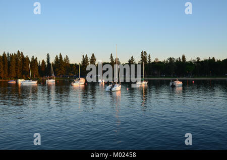Sail boats at sunset in the harbour Stock Photo