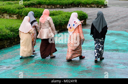 Malaysian women walking in the street, Borneo, Sabah, Malaysia Stock Photo