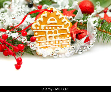 Christmas house from cookie and Xmas decor on white background Stock Photo