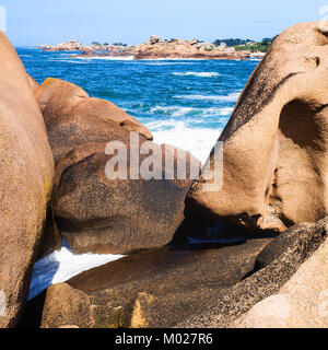 travel to France - boulders on coast of English Channel in Ploumanac'h site of Perros-Guirec commune on Pink Granite Coast of Cotes-d'Armor department Stock Photo