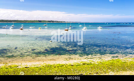 travel to France - boats in bay Anse de Perros of English Channel near Perros-Guirec commune on Pink Granite Coast of Cotes-d'Armor department in the  Stock Photo