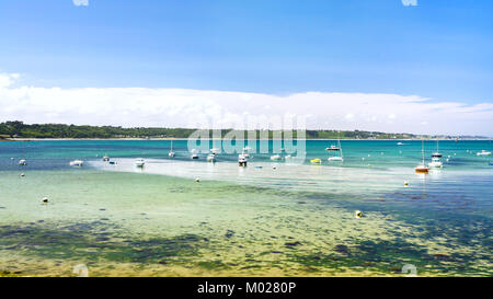 travel to France - ships in bay Anse de Perros of English Channel near Perros-Guirec commune on Pink Granite Coast of Cotes-d'Armor department in the  Stock Photo