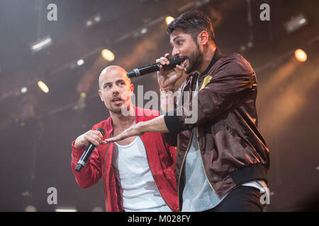 The Norwegian rap group Karpe Diem performs a live concert at the Danish music festival Roskilde Festival 2013. The duo consists of the two rappers Magdi Omar Ytreeide Abdelmaguid (L) and Chirag Rashmikant Patel (R). Denmark, 07/07 2013. Stock Photo