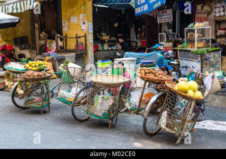 Hanoi,Vietnam - October 31,2017 :  Street vendors selling various types of fruits from their bicycle in Hanoi. Stock Photo