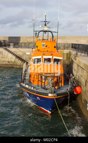 The Trent class RNLI lifeboat Saxon moored in readiness at the quayside in the Irish sea port of donaghadee in County Down in Northern Ireland Stock Photo
