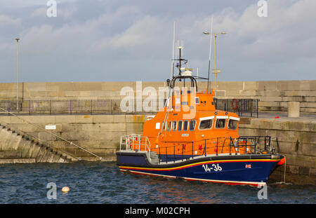 The Trent class RNLI lifeboat Saxon moored in readiness at the quayside in the Irish sea port of donaghadee in County Down in Northern Ireland Stock Photo