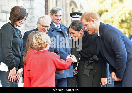 Harry Smith and Megan Taylor, both from Marlborough Primary School, present a wedding gift to Prince Harry and Meghan Markle during a visit to Cardiff Castle. Stock Photo