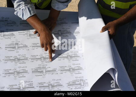 Indian Civil Engineers and foremen are working on the construction site Stock Photo