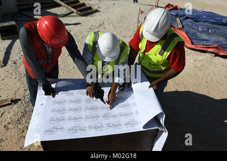 Indian Civil Engineers and foremen are working on the construction site Stock Photo