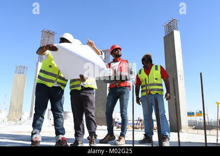 Indian Civil Engineers and foremen are working on the construction site Stock Photo