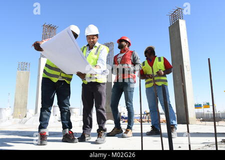 Indian Civil Engineers and foremen are working on the construction site Stock Photo