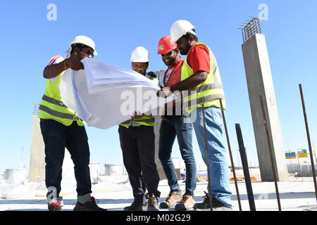 Indian Civil Engineers and foremen are working on the construction site Stock Photo