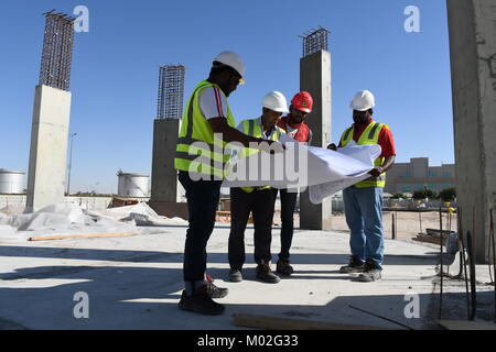 Indian Civil Engineers and foremen are working on the construction site Stock Photo