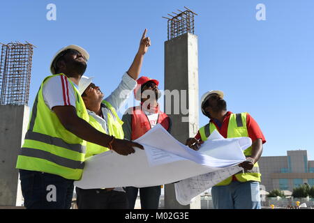 Indian Civil Engineers and foremen are working on the construction site Stock Photo