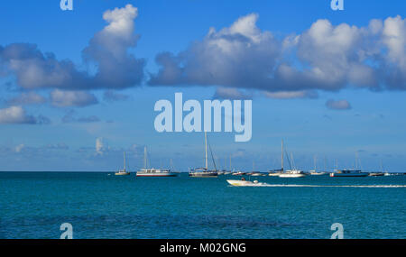 Trou-aux-Biche, Mauritius - Jan 9, 2017. Boats on beautiful sea at spring in Trou-aux-Biches, Mauritius Island. Stock Photo