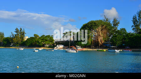 Trou-aux-Biche, Mauritius - Jan 9, 2017. Speedboats docking at the pier in Trou-aux-Biches, Mauritius Island. Stock Photo