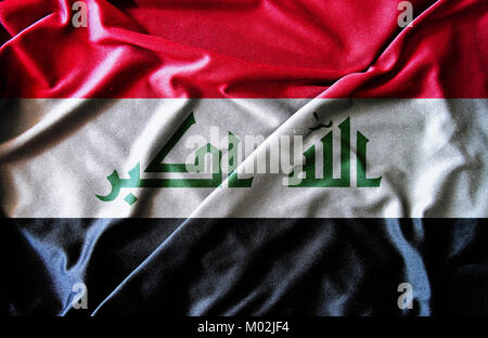 Detail of the Iraq national flag waving. Red, white, black stripes ...
