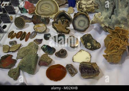 Lot of various different crystals displayed on table Stock Photo