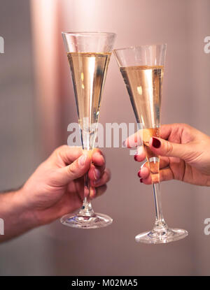 Champagne glasses in man and woman hands. Dating and love concept Stock Photo