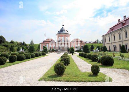 Ancient Zolochiv Castle against blue sky, garden and old sculptures in Lviv region, Ukraine Stock Photo