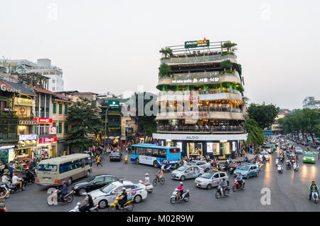 Hanoi,Vietnam - November 2,2017 : View of busy traffic in an intersection with many motorbikes and vehicles in Hanoi, capital of Vietnam. Stock Photo