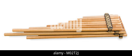 Pan flute (zampona, siku) close-up on white background. Musical wind instrument. Andean folk music. Stock Photo