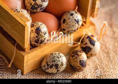Fresh farm brown eggs on rustic background Stock Photo