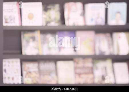 Abstract blurred books, , bookshelves with books, library or book store, for light backdrop. Concept of learning, school, education Stock Photo