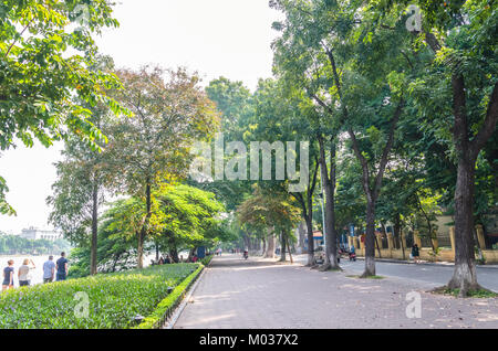 Hanoi,Vietnam - November 2,2017 : Scenic view of the lakeside of Hoan Kiem Lake, people can seen relaxing and exploring around it. Stock Photo