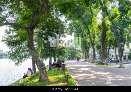 Hanoi,Vietnam - November 2,2017 : Scenic view of the lakeside of Hoan Kiem Lake, people can seen relaxing and exploring around it. Stock Photo