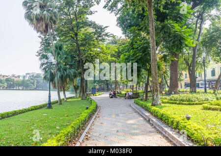 Hanoi,Vietnam - November 2,2017 : Scenic view of the lakeside of Hoan Kiem Lake, people can seen relaxing and exploring around it. Stock Photo