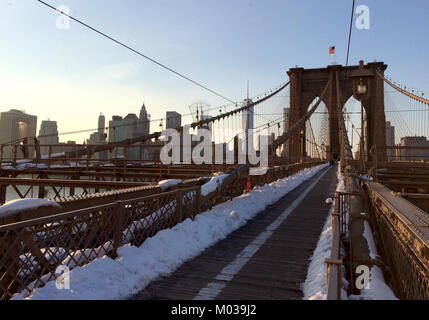 The Brooklyn Bridge, one of New York City's most iconic landmarks, spans the East River, connecting Manhattan and Brooklyn. This photo captures its majestic architecture and significance as a transportation and cultural hub in 2014. Stock Photo