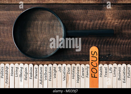 Magnifying glass and wooden sticks With LIFESTYLE related word. focus on lifestyle concept Stock Photo