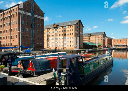 Gloucester, UK - 18th July 2016: Summer sunshine brings visitors to explore the industrial heritage of Gloucester Docks, Gloucester, UK. This historic docks area can trace its roots back to the 1800's and was once the UK’s most inland shipping port. Today leisure boating has mostly replaced the ships and barges and the docks are a lively visitor attraction. Stock Photo