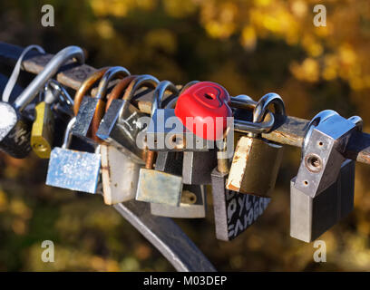 Padlocks on fence on bridge in Kiev, symbol of love Stock Photo