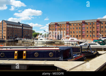 Gloucester, UK - 18th July 2016: Summer sunshine brings visitors to explore the industrial heritage of Gloucester Docks, Gloucester, UK. This historic docks area can trace its roots back to the 1800's and was once the UK’s most inland shipping port. Today leisure boating has mostly replaced the ships and barges and the docks are a lively visitor attraction. Stock Photo