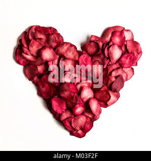 Love heart made from red rose petals Stock Photo