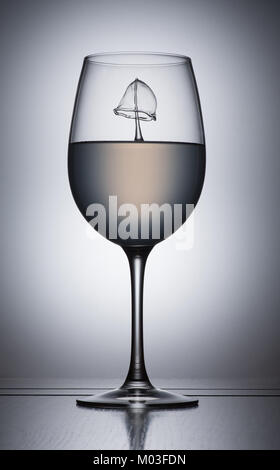 Water Droplet splash in a glass Stock Photo