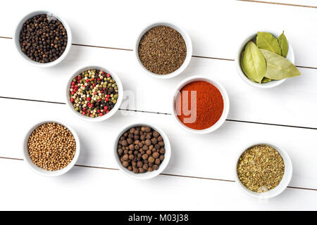 Herbs and spices in white bowls. Food background Stock Photo