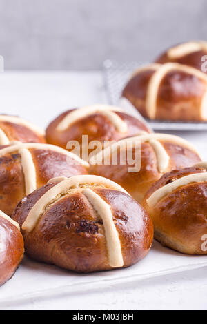 Traditional Easter hot cross buns on holiday table Stock Photo