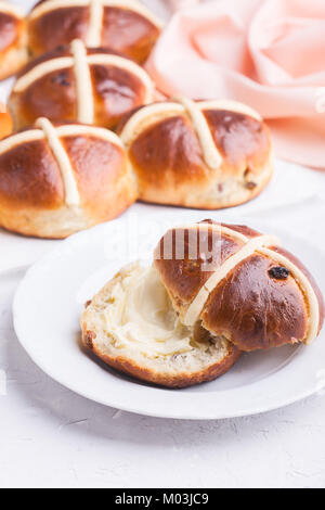Traditional Easter hot cross buns on holiday table Stock Photo