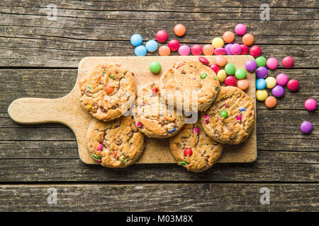 Sweet cookies with colorful candies. Top view. Stock Photo