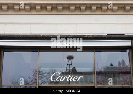 PARIS, FRANCE - DECEMBER 20, 2017: Cartier logo on their main shop on Champs Elysee avenue. Cartier is a French luxury goods conglomerate company whic