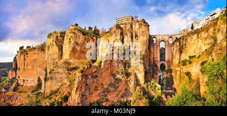 Panoramic view of the old city of Ronda, one of the famous white villages, at sunset in the province of Malaga, Andalusia, Spain Stock Photo