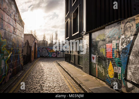 Grimsby Street, just off Brick Lane in east London, is the epitome of the area where street art blends with modern style housing. Stock Photo