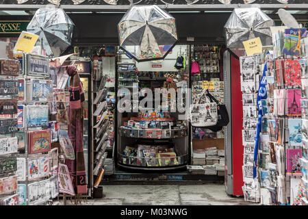 PARIS, FRANCE - DECEMBER 20, 2017: Souvenir Shop on the Paris avenue of Champs Elysees, in a kiosk, displaying various items branded with the Eiffel t Stock Photo