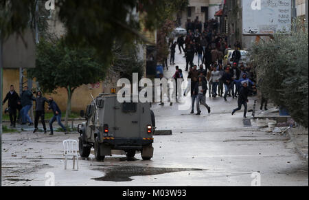 Jenin. 18th Jan, 2018. Clashes break out between Palestinians and Israeli soldiers in the West Bank city of Jenin, on Jan. 18, 2018. Palestinian sources said Thursday a Palestinian man was killed during a clash that broke out between Palestinians and Israeli forces in north West Bank city Jenin. Credit: Ayman Nobani/Xinhua/Alamy Live News Stock Photo