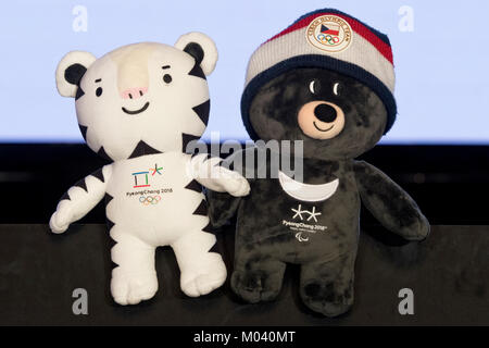 Prague, Czech Republic. 18th Jan, 2018. Plenary session of Czech Olympic Committee (COV) on nomination of athletes for forthcoming Winter Olympic Games 2018 in Pyeongchang, South Korea, was held in Prague, Czech Republic, on Thursday, January 18, 2018. On the photo are seen Olympic mascot Soohorang (left) and Paralympic mascot Bandabi with Czech Olympic Team beanie. Credit: Michal Kamaryt/CTK Photo/Alamy Live News Stock Photo